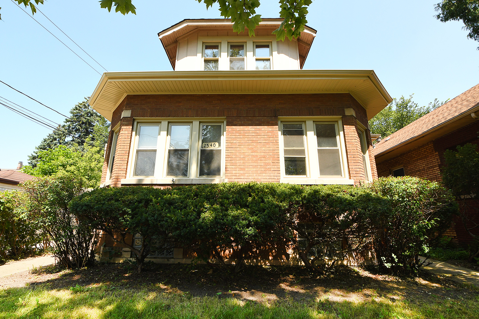 2540 Lewis Street Blue Island, IL 60406 - Photo 2 of 27 a front view of a house with a yard
