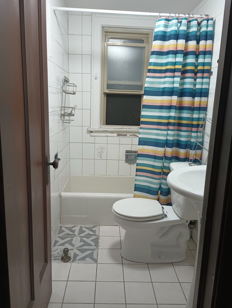 2540 Lewis Street Blue Island, IL 60406 - Photo 21 of 27 a bathroom with a sink and a mirror