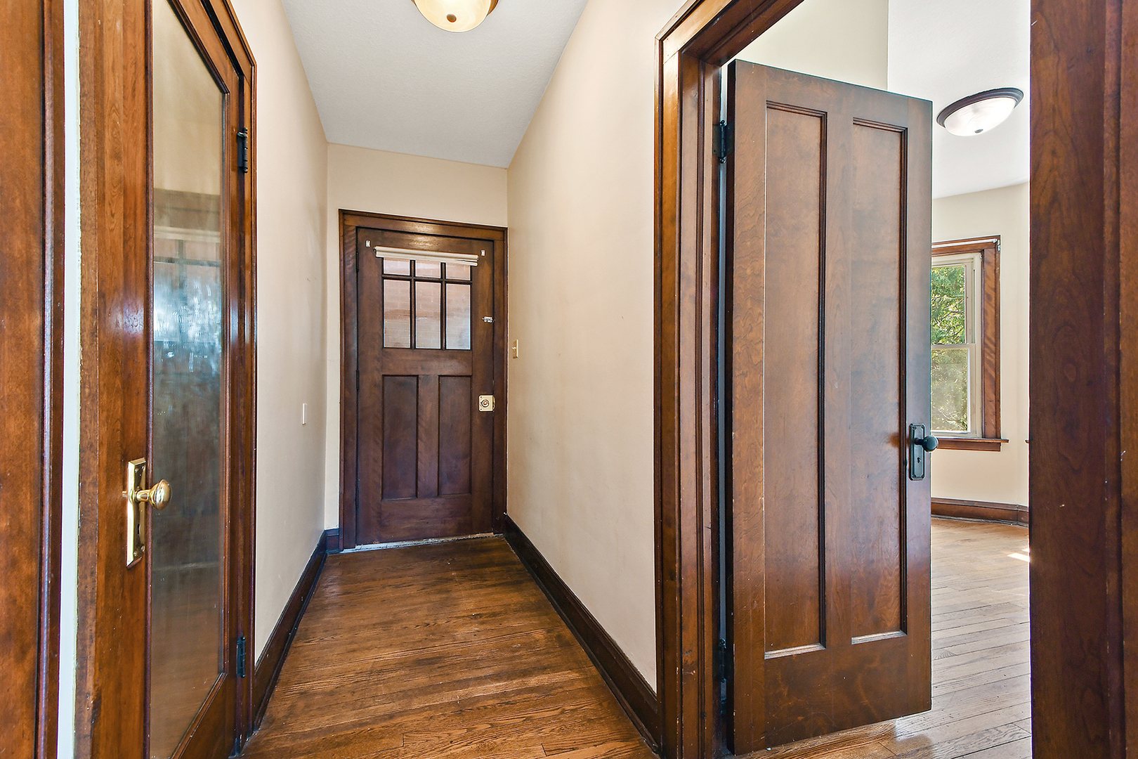 2540 Lewis Street Blue Island, IL 60406 - Photo 5 of 27 a view of a hallway with wooden floor and entryway