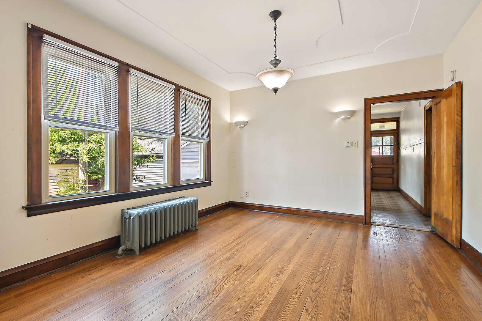 2540 Lewis Street Blue Island, IL 60406 - Photo 6 of 27 a view of an empty room with wooden floor and a window