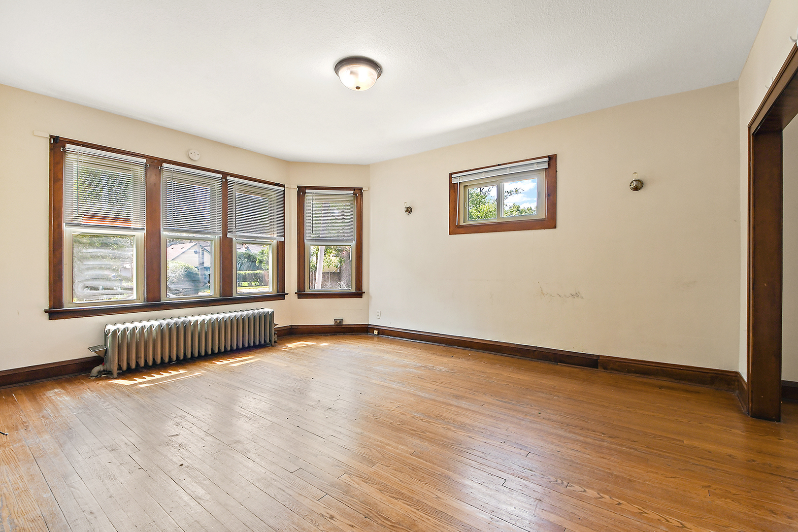 2540 Lewis Street Blue Island, IL 60406 - Photo 7 of 27 an empty room with wooden floor and windows