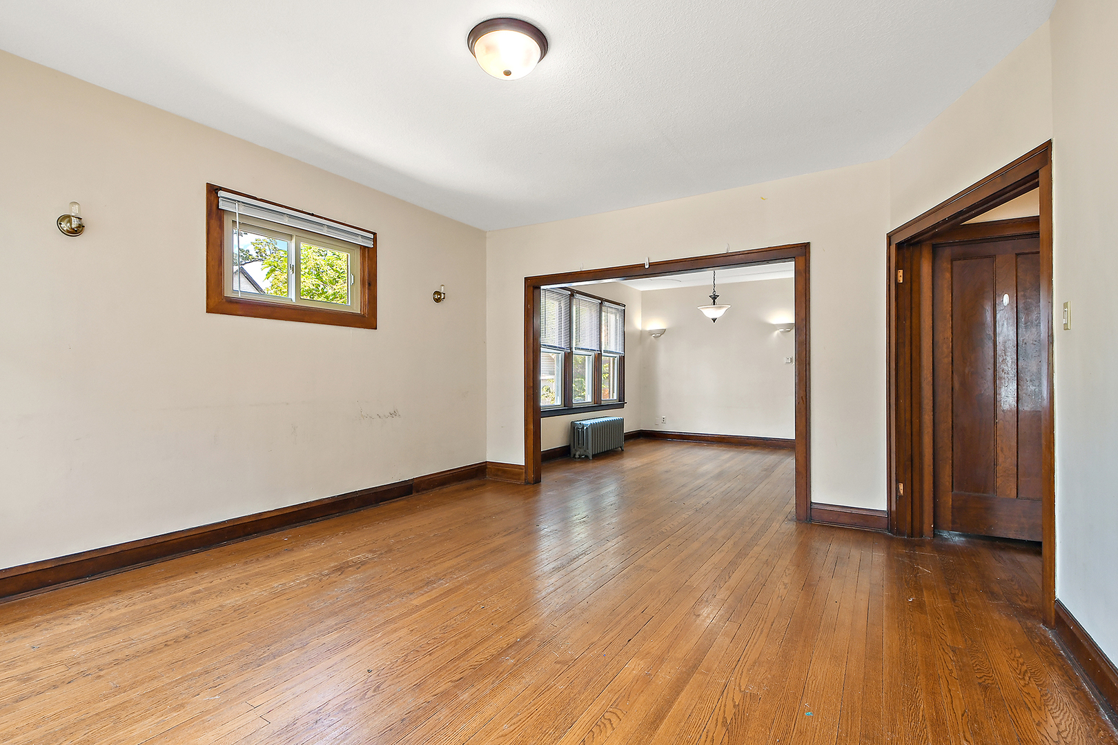 2540 Lewis Street Blue Island, IL 60406 - Photo 8 of 27 an empty room with wooden floor and windows