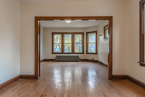 2540 Lewis Street Blue Island, IL 60406 - Photo 9 of 27 an empty room with wooden floor and windows