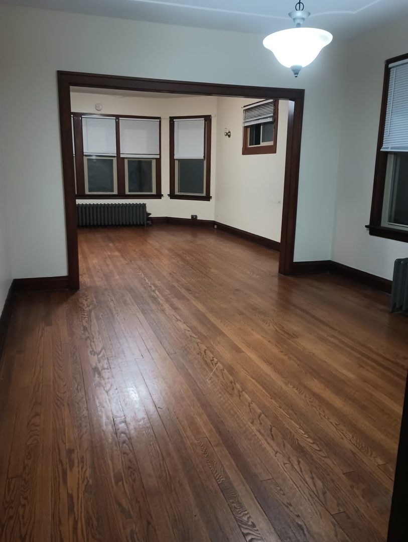2540 Lewis Street Blue Island, IL 60406 - Photo 10 of 27 an empty room with wooden floor and windows