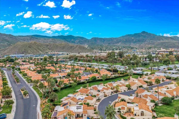 a view of a city with mountains in the background