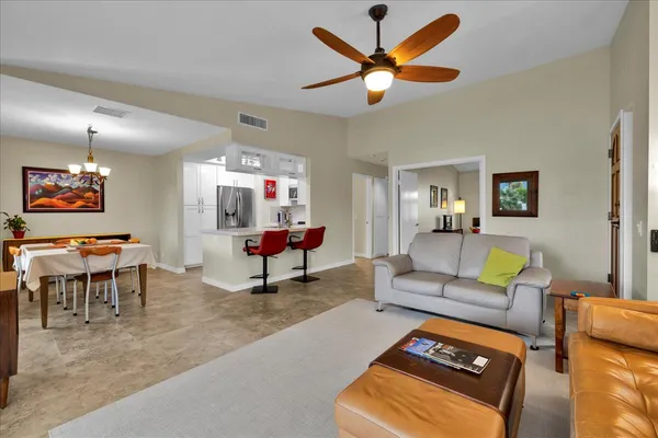 a living room with furniture and a rug