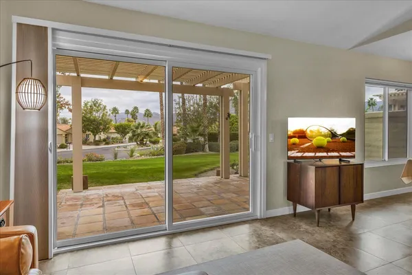 a view of a living room and floor to ceiling window