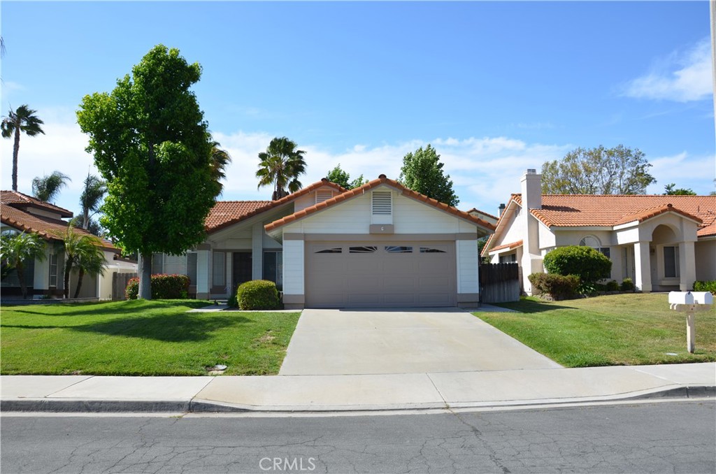 front view of a house and a yard