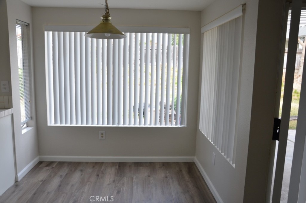 29620 Nightcrest Circle Temecula, CA 92591 - Photo 11 of 31 an empty room with wooden floor and windows