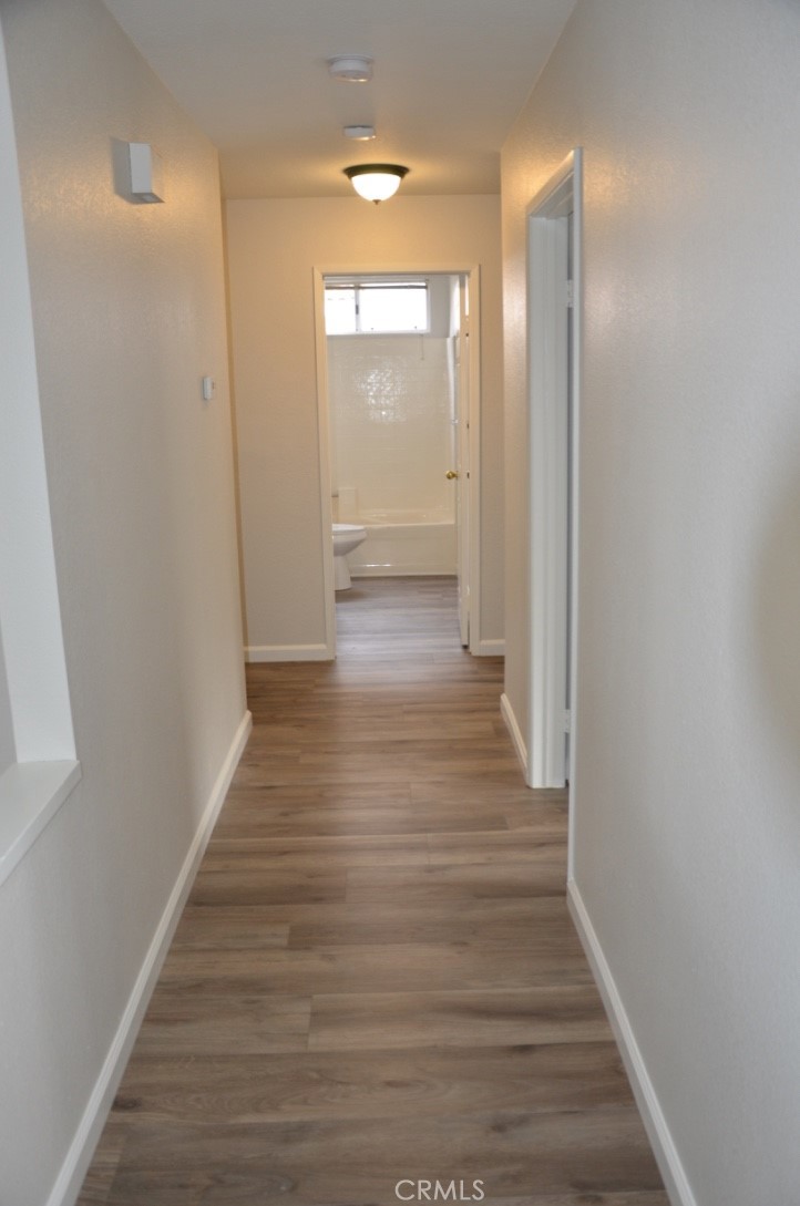 29620 Nightcrest Circle Temecula, CA 92591 - Photo 13 of 31 a view of a hallway with wooden floor