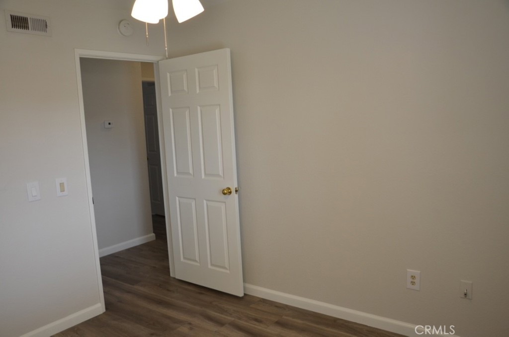 29620 Nightcrest Circle Temecula, CA 92591 - Photo 15 of 31 a view of a hallway with wooden floor