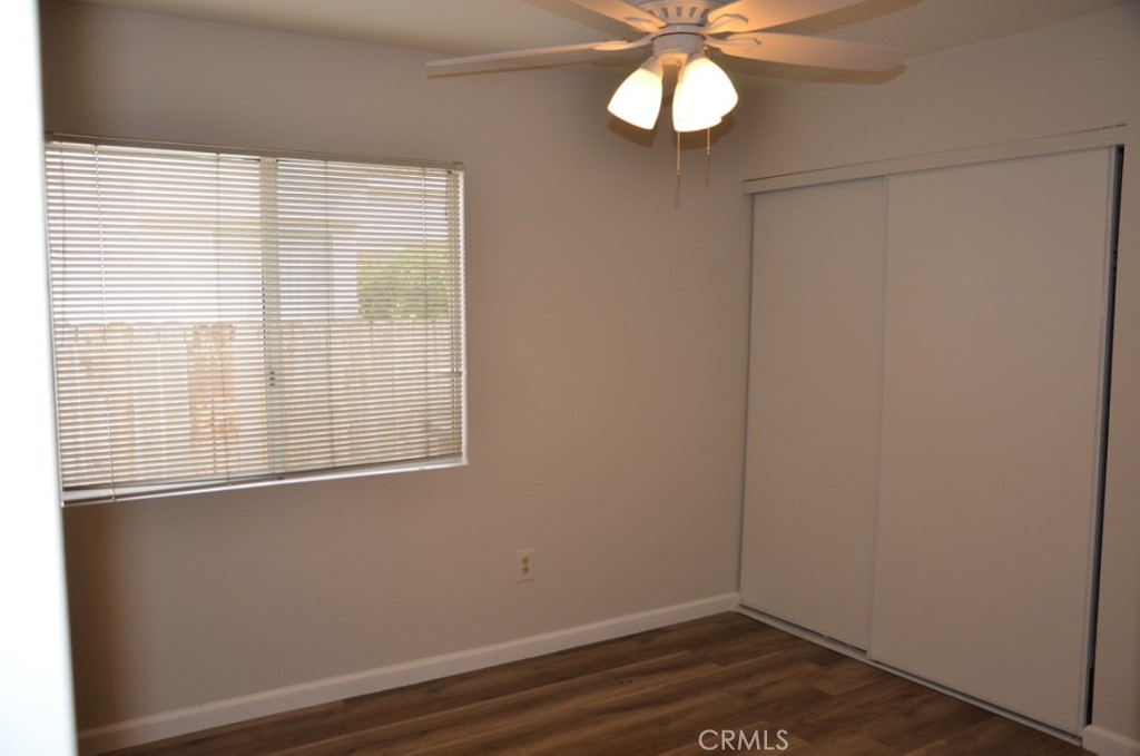 29620 Nightcrest Circle Temecula, CA 92591 - Photo 16 of 31 an empty room with wooden floor fan and window