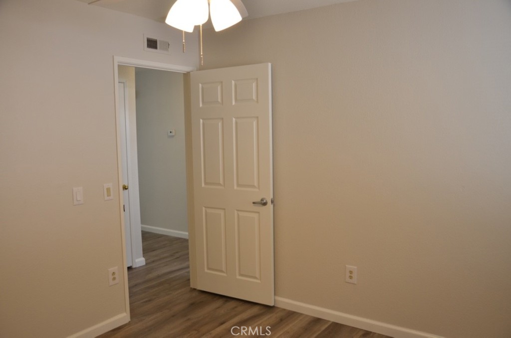 29620 Nightcrest Circle Temecula, CA 92591 - Photo 17 of 31 a view of a hallway with wooden floor