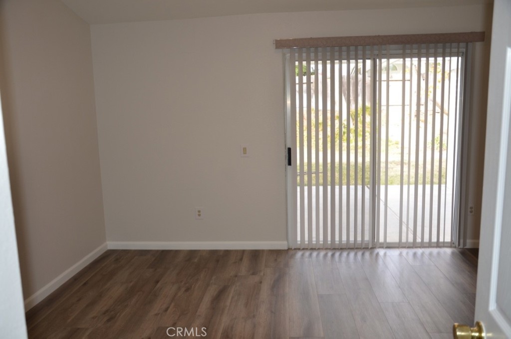 29620 Nightcrest Circle Temecula, CA 92591 - Photo 21 of 31 an empty room with wooden floor and windows