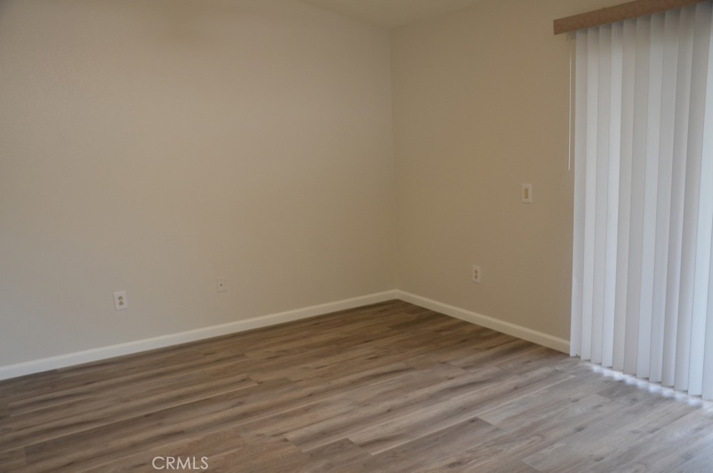 29620 Nightcrest Circle Temecula, CA 92591 - Photo 22 of 31 a view of an empty room with wooden floor