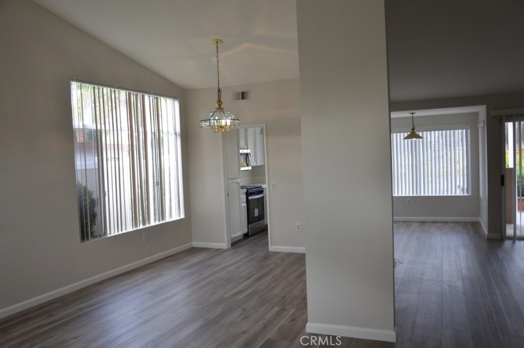29620 Nightcrest Circle Temecula, CA 92591 - Photo 5 of 31 an empty room with wooden floor and a window