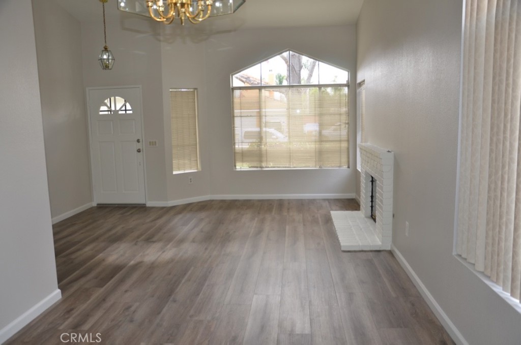 29620 Nightcrest Circle Temecula, CA 92591 - Photo 6 of 31 an empty room with wooden floor and windows