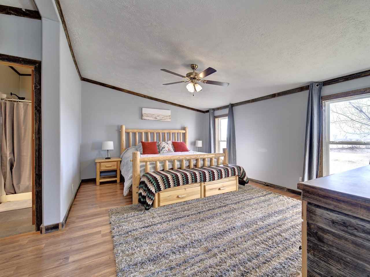 1675 North 1/2 Road Fruita, CO 81521 - Photo 13 of 31 a bedroom with a bed and a window