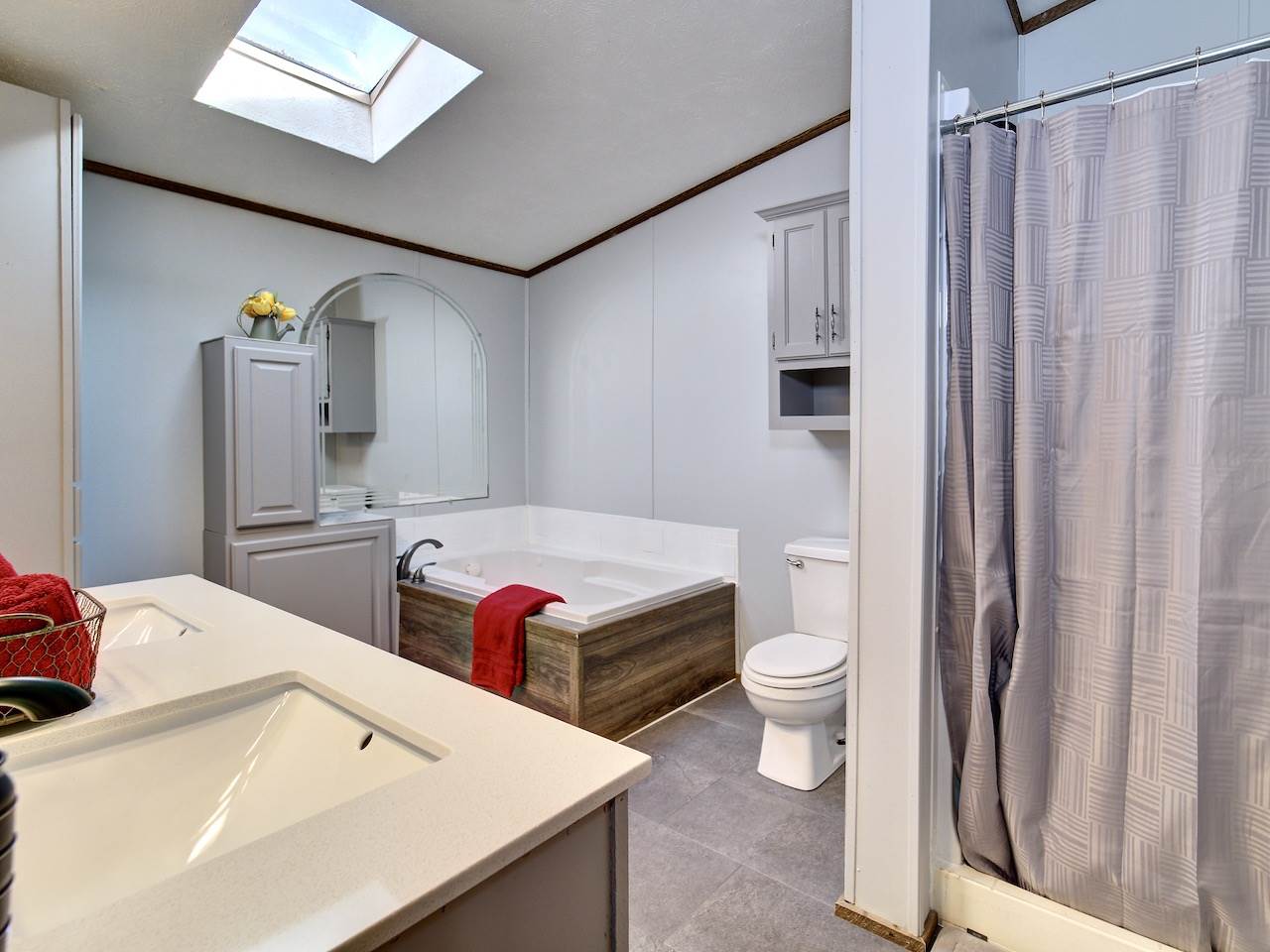 1675 North 1/2 Road Fruita, CO 81521 - Photo 15 of 31 a bathroom with a sink a toilet and shower curtain
