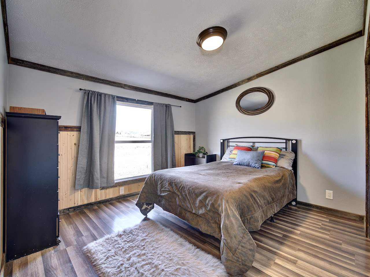 1675 North 1/2 Road Fruita, CO 81521 - Photo 18 of 31 a bedroom with a bed and window