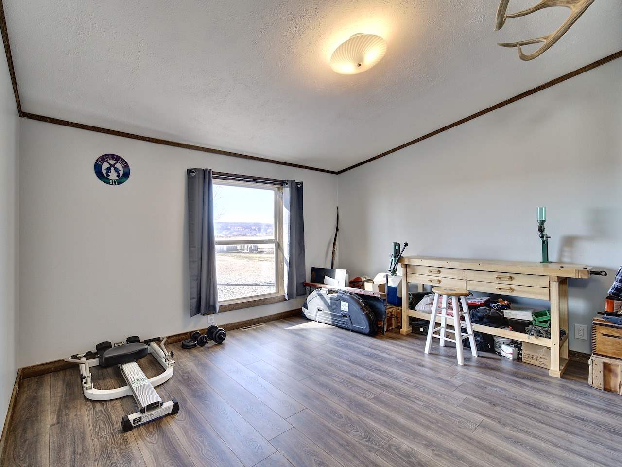 1675 North 1/2 Road Fruita, CO 81521 - Photo 20 of 31 a living room with lots of furniture and a large window