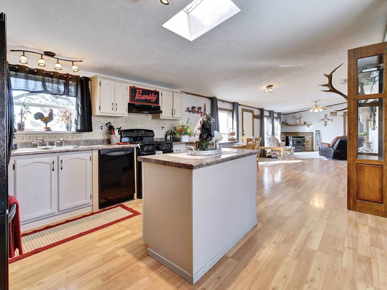 1675 North 1/2 Road Fruita, CO 81521 - Photo 5 of 31 a kitchen with stainless steel appliances granite countertop a stove top oven and cabinets