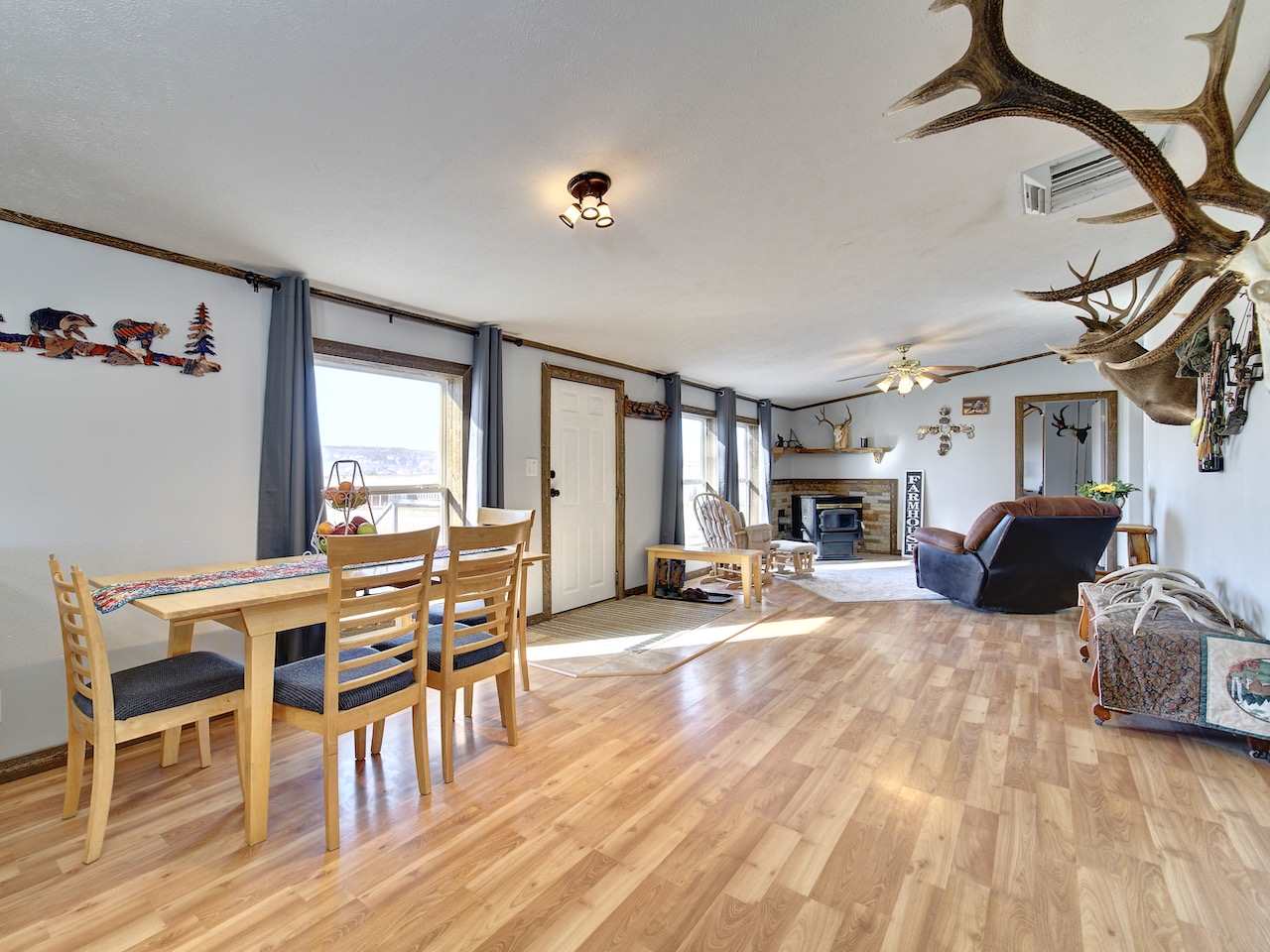 1675 North 1/2 Road Fruita, CO 81521 - Photo 7 of 31 a view of a livingroom with furniture a fireplace and wooden floor