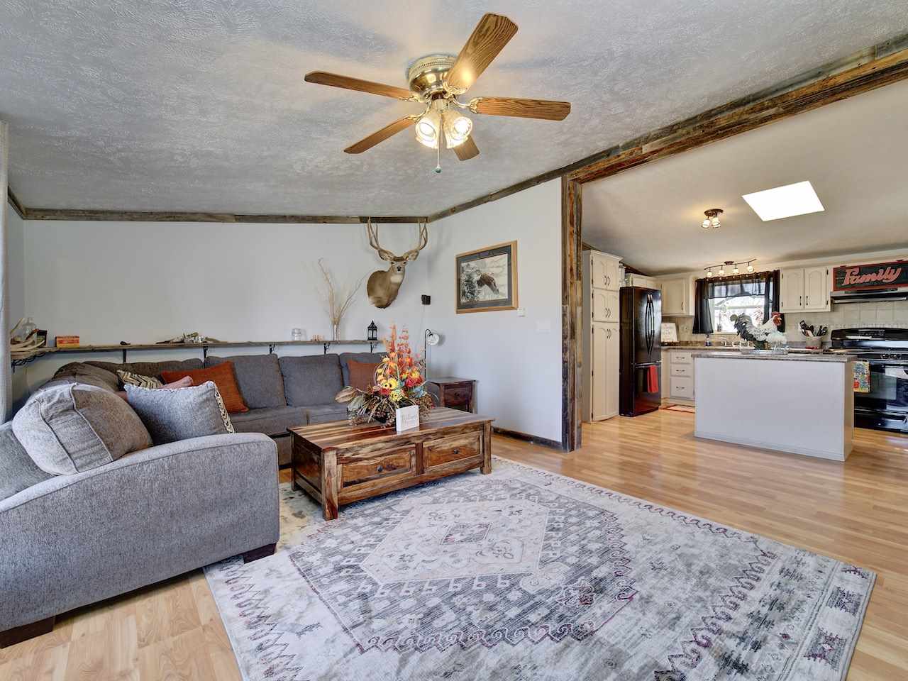 1675 North 1/2 Road Fruita, CO 81521 - Photo 10 of 31 a living room with furniture and kitchen view