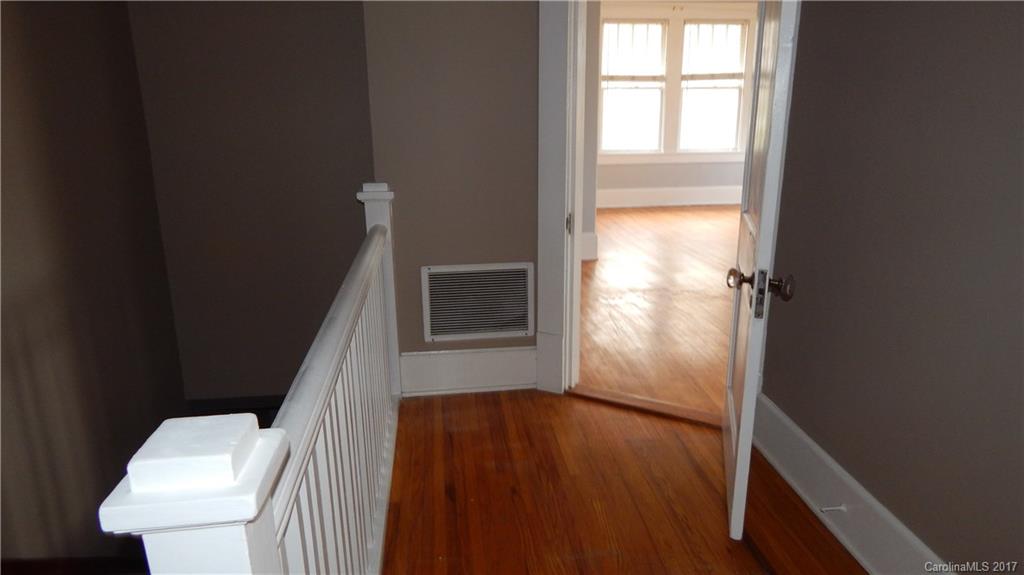 203 Charles Street, Unit A Monroe, NC 28112 - Photo 3 of 10 a bathroom with a toilet