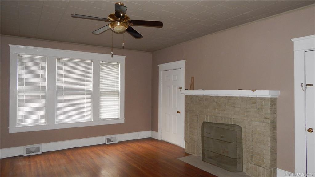 203 Charles Street, Unit A Monroe, NC 28112 - Photo 5 of 10 a view of empty room with ceiling fan