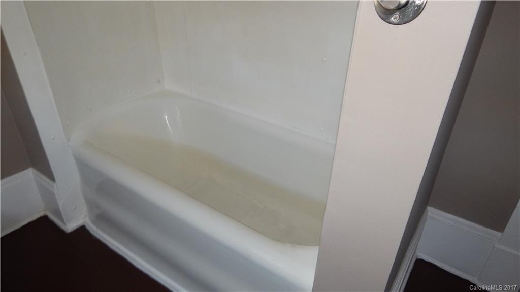 203 Charles Street, Unit A Monroe, NC 28112 - Photo 8 of 10 a bathroom with a bathtub