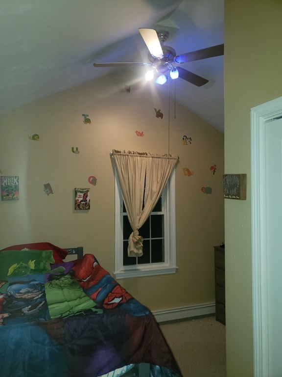 191 Holmes Road North Attleboro, MA 02760 - Photo 13 of 31 a living room with a bed and a chandelier