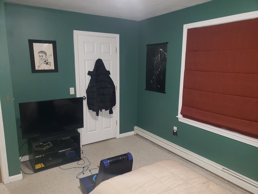 191 Holmes Road North Attleboro, MA 02760 - Photo 18 of 31 a living room with furniture and a flat screen tv