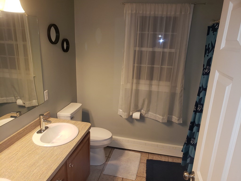 191 Holmes Road North Attleboro, MA 02760 - Photo 19 of 31 a bathroom with a sink toilet and shower