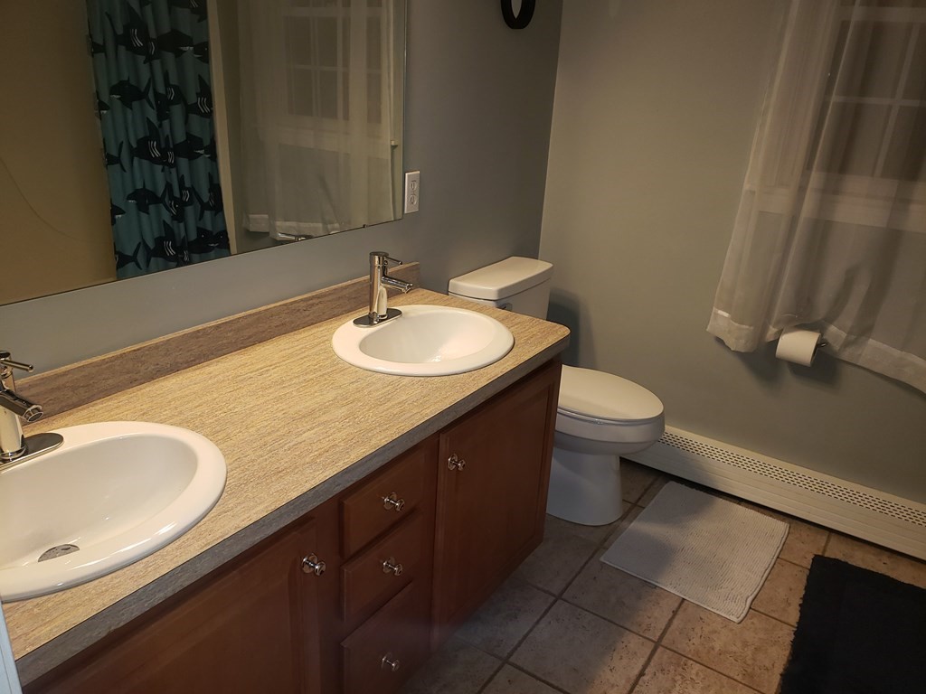 191 Holmes Road North Attleboro, MA 02760 - Photo 20 of 31 a bathroom with a sink and a toilet