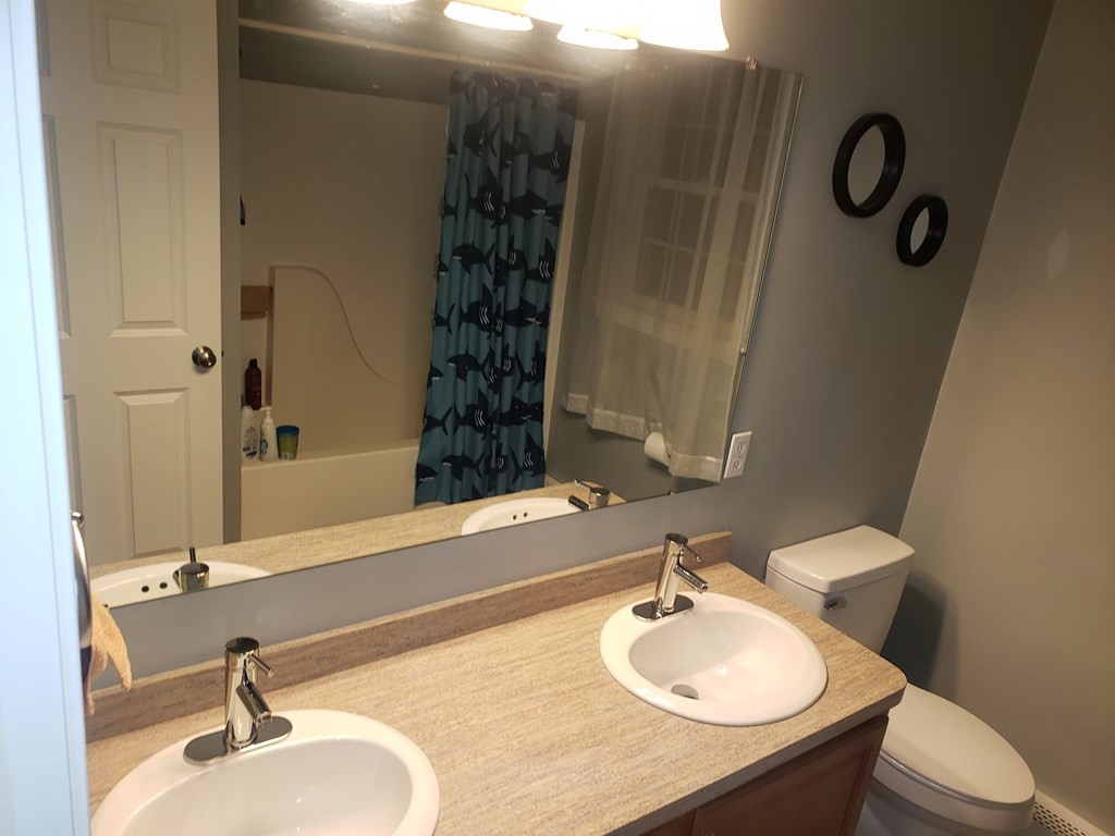 191 Holmes Road North Attleboro, MA 02760 - Photo 21 of 31 a bathroom with a sink toilet and shower