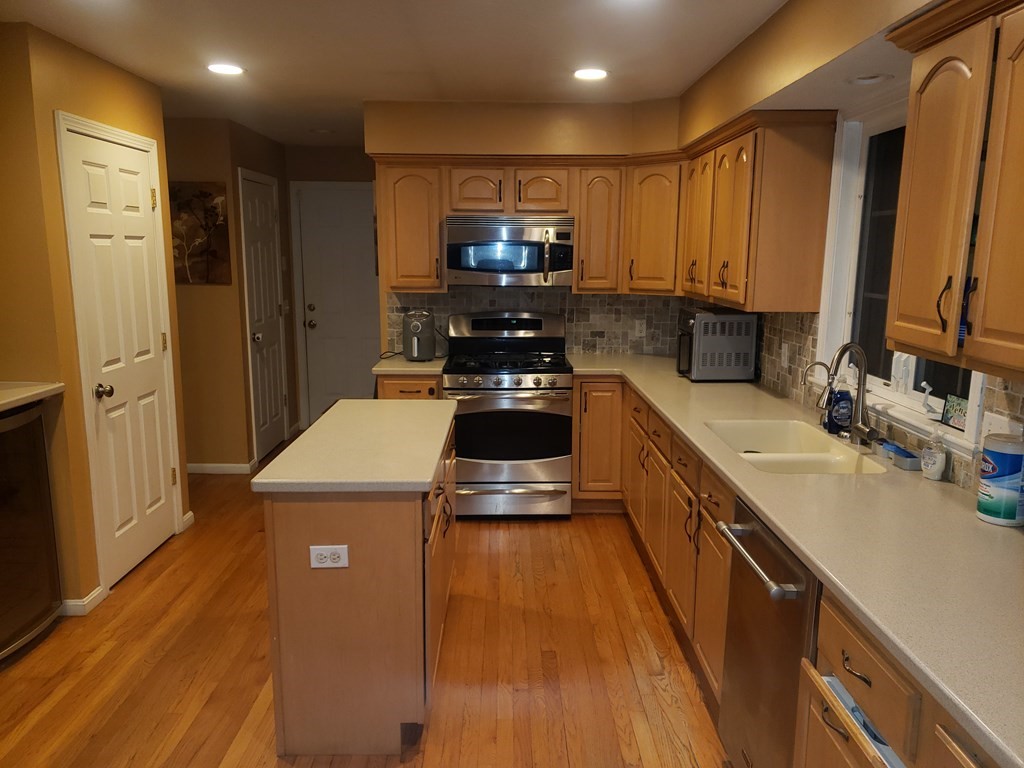 191 Holmes Road North Attleboro, MA 02760 - Photo 5 of 31 a kitchen with a sink and a refrigerator