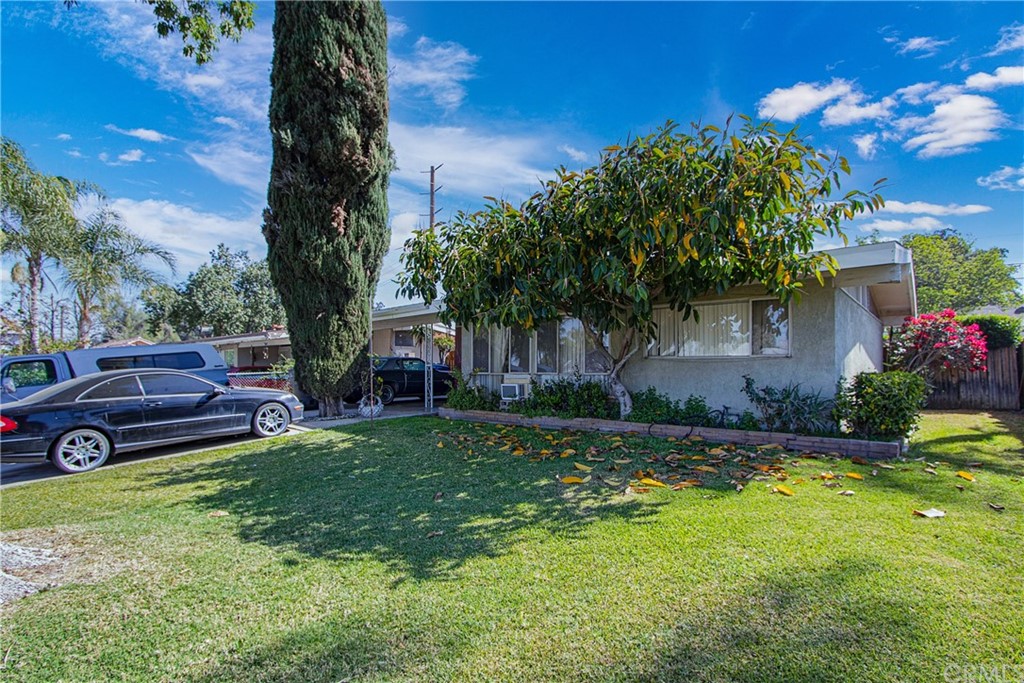 4230 Angelo Street Riverside, CA 92507 - Photo 1 of 1 a view of a house with backyard and a tree