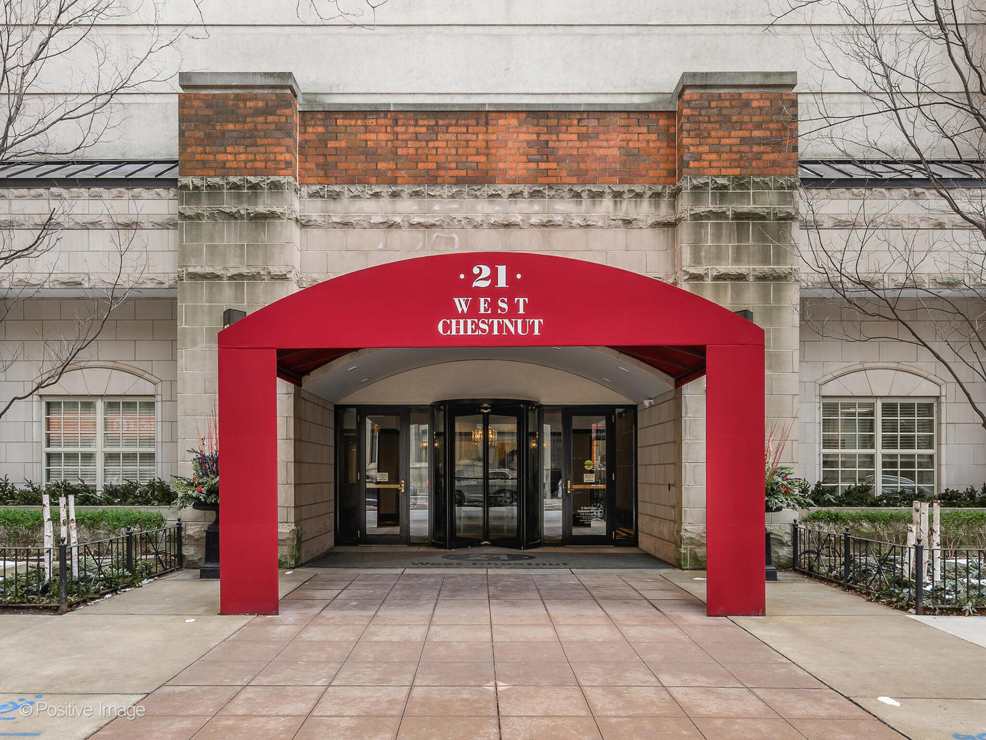 21 West Chestnut Street, Unit 1202 Chicago, IL 60654 - Photo 2 of 29 a front view of a building with retail shops