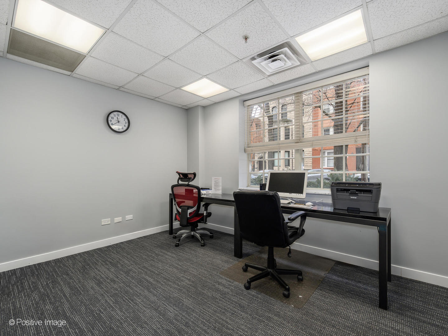 21 West Chestnut Street, Unit 1202 Chicago, IL 60654 - Photo 28 of 29 a view of a workspace with furniture and a window