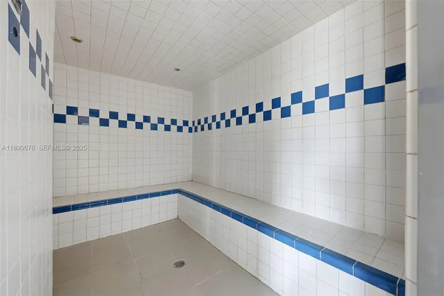a bathroom with a shower and a sink
