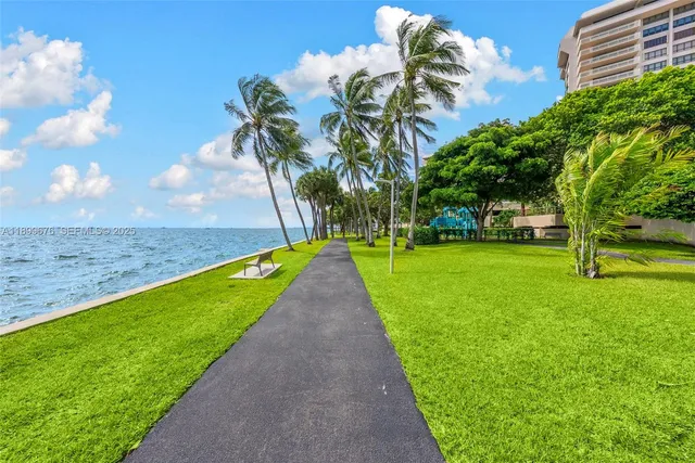 a view of a park with large trees
