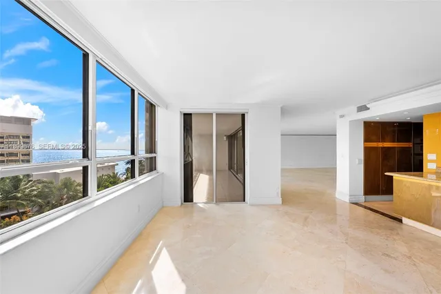 a view of a living room with a large window