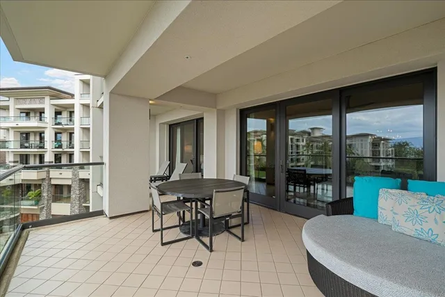 a view of a chairs and table in patio