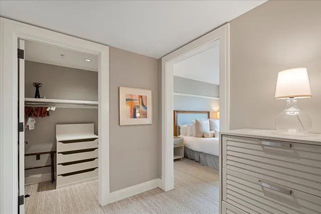 a bathroom with a granite countertop sink a mirror and bathtub