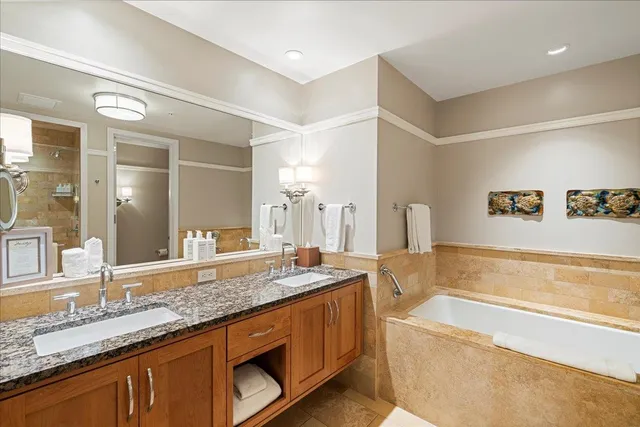 a bathroom with a bathtub and shower