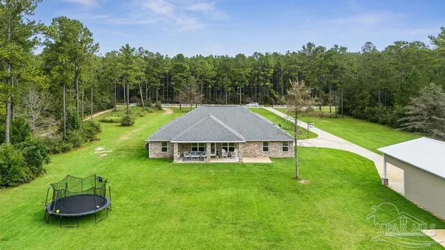 a view of a house with a big yard