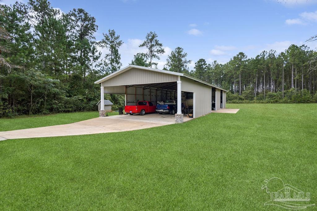 1571 Annie Penton Road Jay, FL 32565 - Photo 15 of 46 a view of a house with a yard
