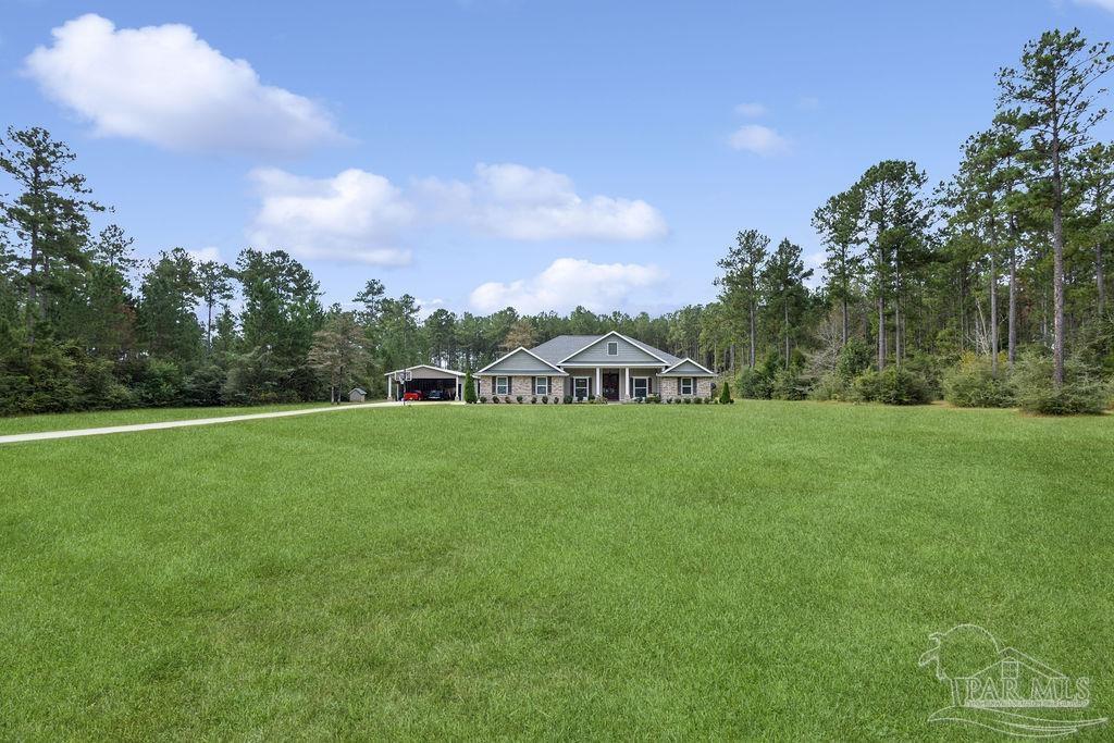 1571 Annie Penton Road Jay, FL 32565 - Photo 16 of 46 a view of a house with a big yard