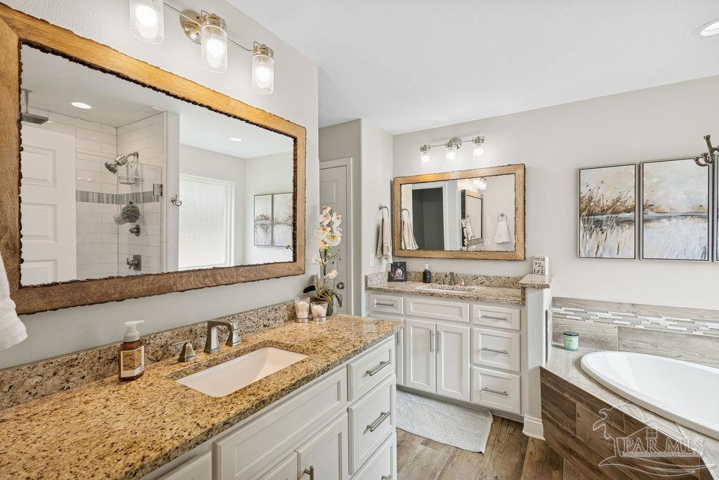 1571 Annie Penton Road Jay, FL 32565 - Photo 20 of 46 a bathroom with a granite countertop double vanity sink and a mirror